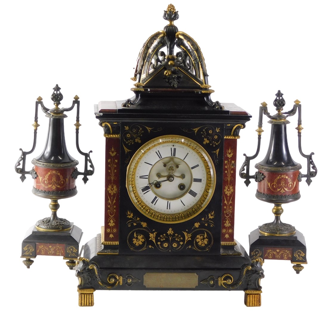 A late 19thC French black slate, marble and bronze clock garniture by HY Marc of Paris, the clock ca