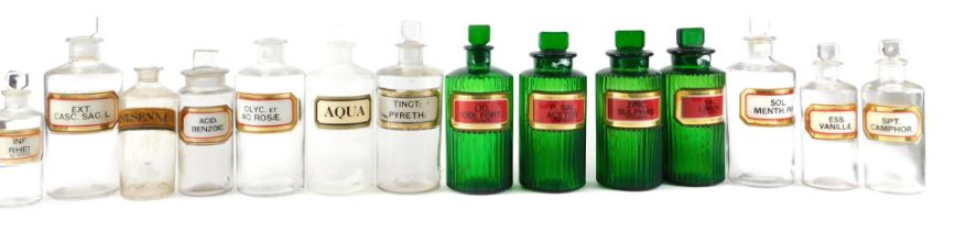 A collection of chemist or laboratory jars, with various names, to include four green tinted example