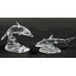 Two Swarovski crystal sea animals, comprising a dolphin riding wave, 9cm high, and a blue fin shark,