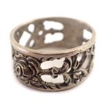 An Eastern wedding band, of pierced and scroll design, white metal stamped 835, ring size Q½, 4.9g a