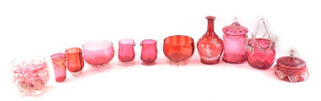 A group of 19thC and later cranberry glasswares, comprising three miniature milk jugs, a sweet jar a