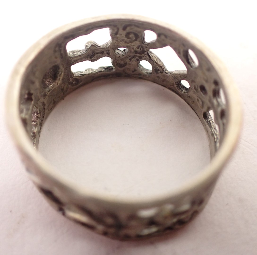An Eastern wedding band, of pierced and scroll design, white metal stamped 835, ring size Q½, 4.9g a - Image 2 of 2