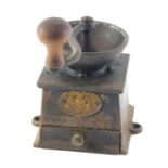 A Kendrick & Sons cast iron coffee mill or grinder, 14cm wide.
