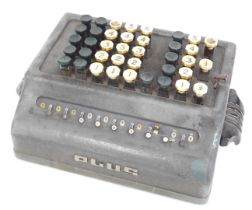 A Plus 1960s adding machine, 23cm wide, 18cm deep.