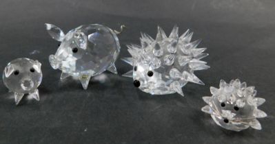 Four Swarovski crystal animal ornaments, comprising large hedgehog 3cm high, small hedgehog 2cm high