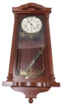 A Hermle wall clock, with Westminster chime, in a mahogany case, 69cm high.