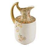 A Doulton Burslem ceramic water jug, with a gilded handle and border, transfer printed decoration of