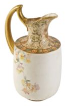 A Doulton Burslem ceramic water jug, with a gilded handle and border, transfer printed decoration of