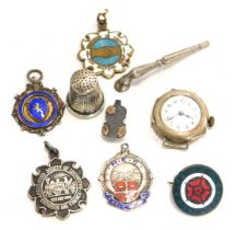 Various silver and white metal wares, comprising a silver thimble, silver cased wristwatch, two Engi