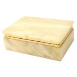 An onyx rectangular jewellery box, with gilded rim, 5.5cm high, 16cm wide, 10.5cm deep.