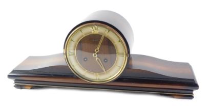 A Judith mantel clock, in simulated rosewood case, the dial with gilt Roman numerals, 56cm wide.