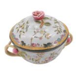 A late Oriental two handled jar and cover, decorated in European style with flowers, etc., 22cm wide