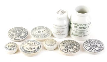 A collection of Boots chemist related pot lids and two jars, to include cold cream, toothpaste, etc.