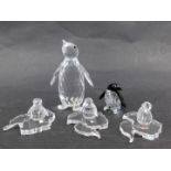 Three Swarovski crystal penguin groups, comprising a black and white crystal penguin 4cm high, an em