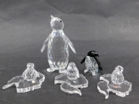 Three Swarovski crystal penguin groups, comprising a black and white crystal penguin 4cm high, an em