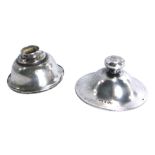 Two items of silver, comprising a George V silver jar top, and a white metal candle stand top, with
