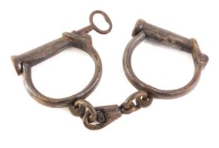 A pair of J Froggatt Victorian police handcuffs, with key.