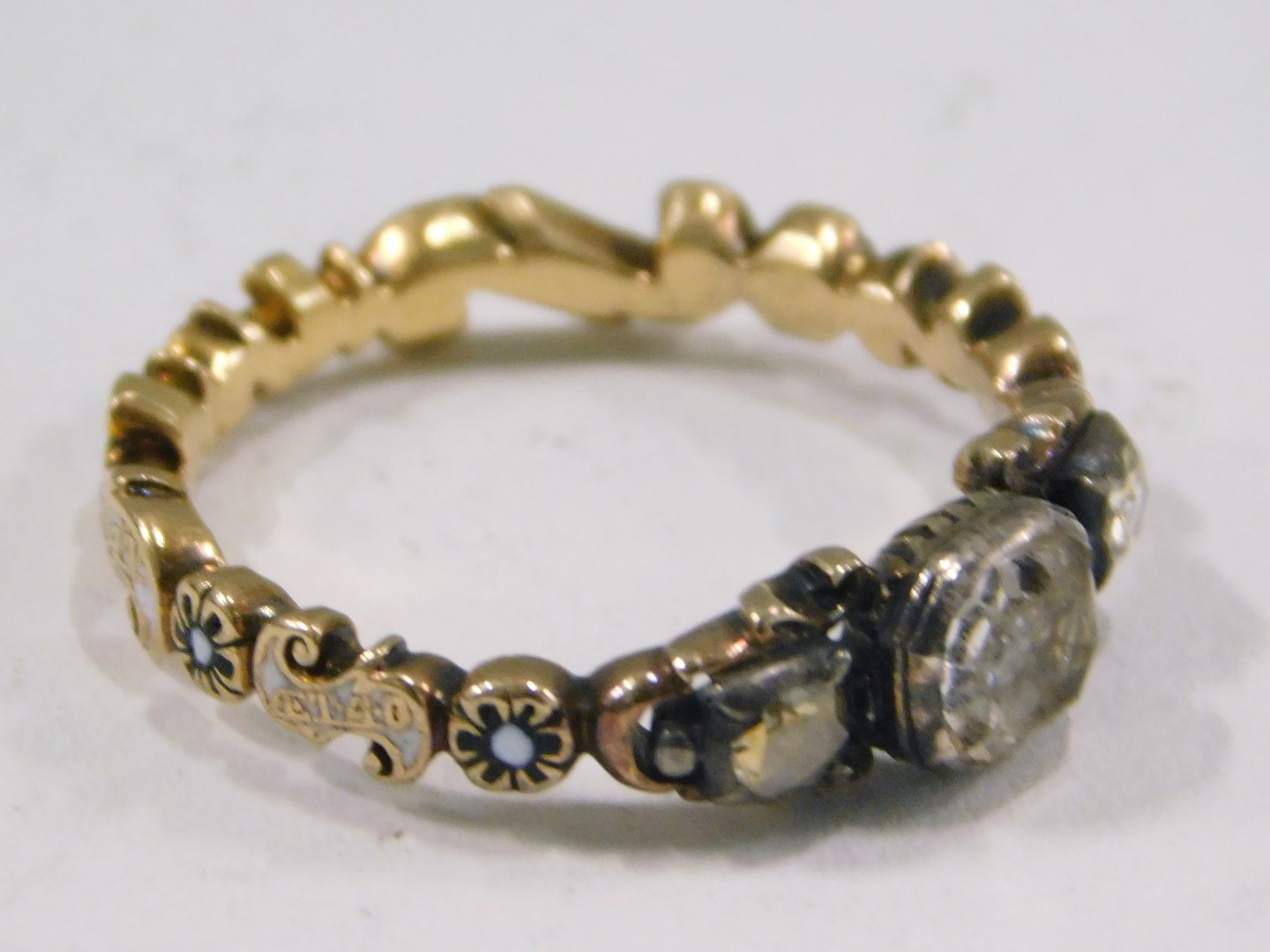 A Victorian memorial dress ring, set with three foil backed old cut imitation diamonds, with enamel - Image 2 of 3