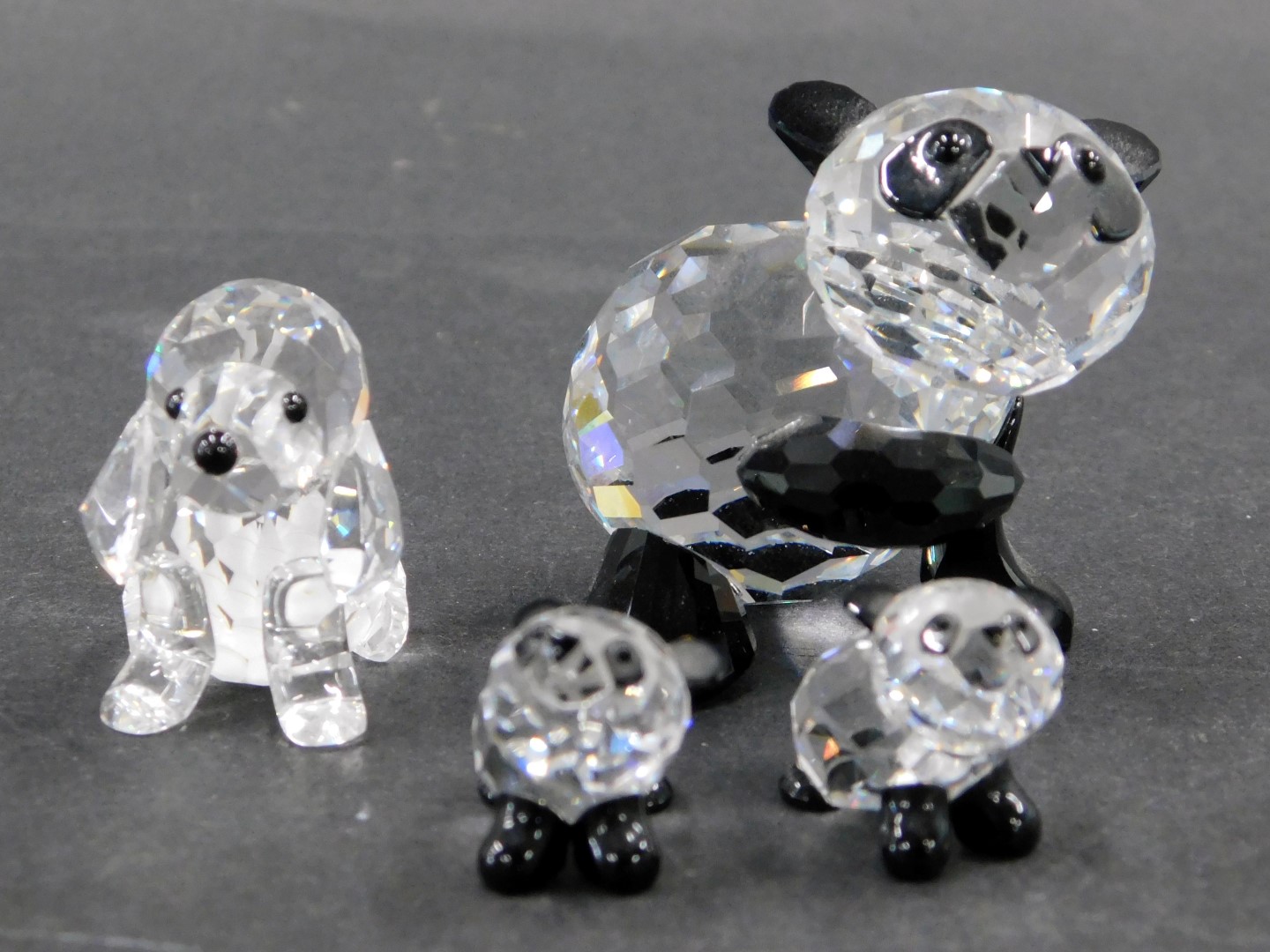 Four Swarovski crystal animal figures, comprising large panda with black face and paws, 4cm high, ba