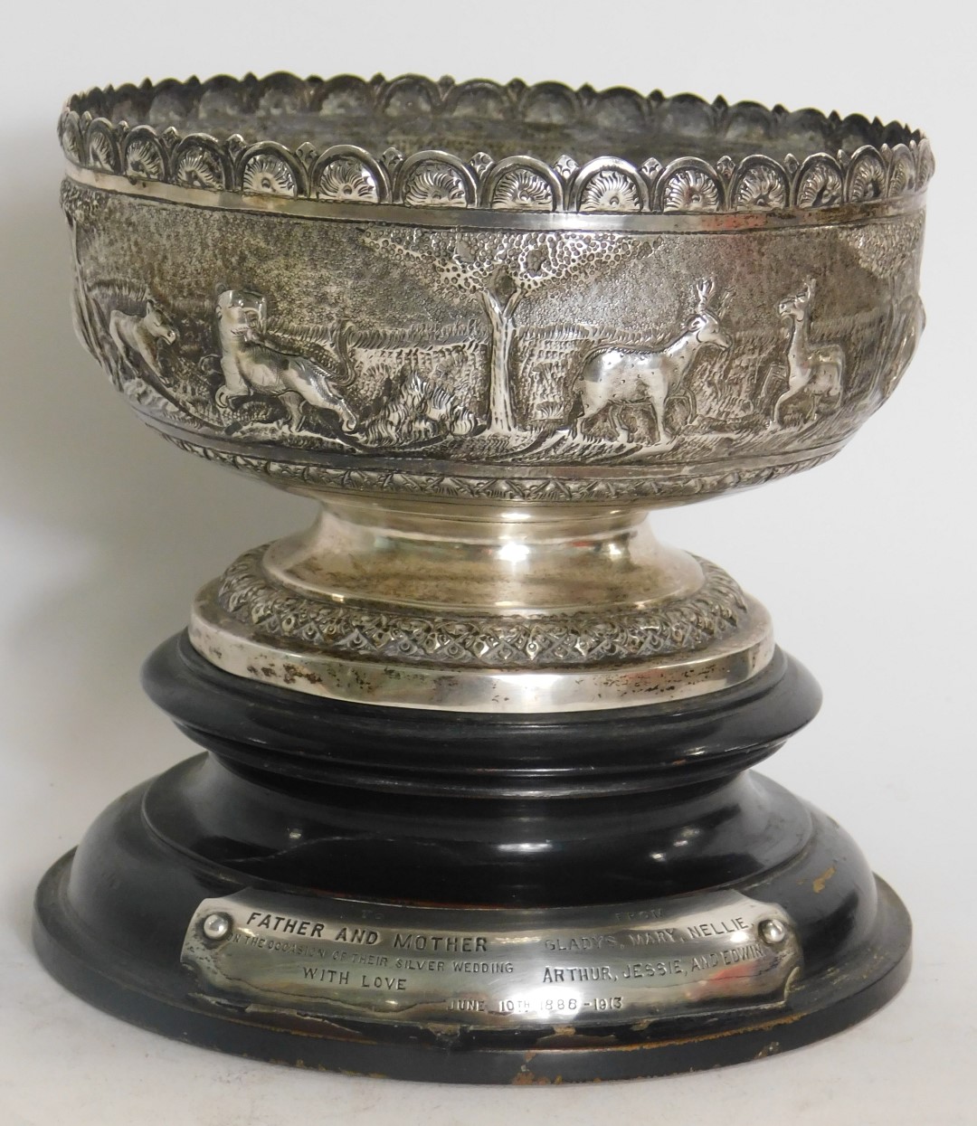 An Indonesian white metal bowl, with hammered safari scene body, on a stepped and ribbed foot, with - Image 2 of 4