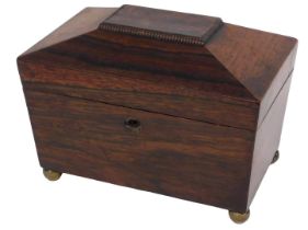 A Victorian rosewood sarcophagus shaped tea caddy, the hinged lid enclosing two lidded divisions, 20