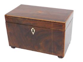 An early 19thC mahogany and rosewood cross banded tea caddy, with boxwood stringing, the hinged lid