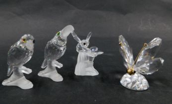 Four Swarovski crystal bird figure groups, comprising pelican on perch (x2) 7cm high, a bee on flowe