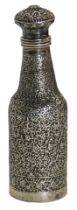 An Eastern white metal scent bottle, of hammered floral design, unmarked, 12cm high, 2.95oz.
