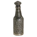 An Eastern white metal scent bottle, of hammered floral design, unmarked, 12cm high, 2.95oz.