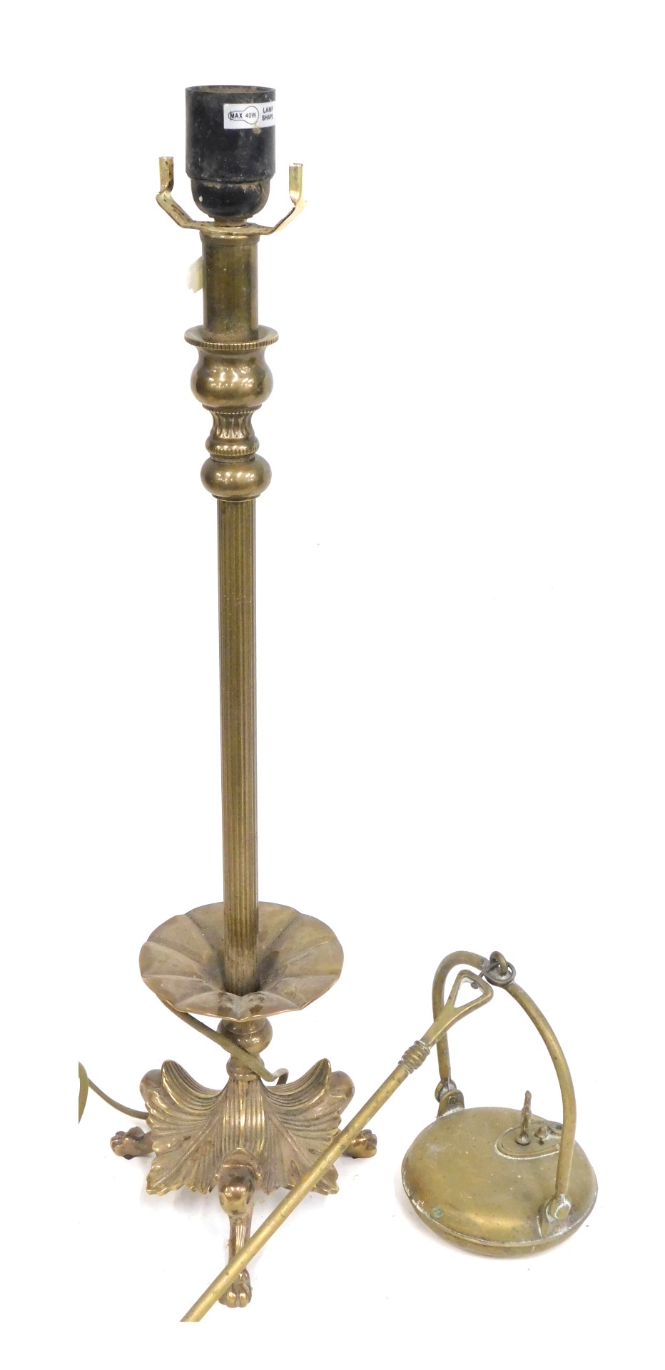A 19thC brass table lamp, converted to electricity, on a moulded leaf base, 62cm high, etc. (2)