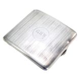 A George VI silver cigarette case, of arched form with engine turned stripe design bearing the initi