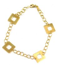 A modern bracelet, with four square link section, on yellow metal clasp, stamped 375, 18cm long, 1.9