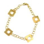 A modern bracelet, with four square link section, on yellow metal clasp, stamped 375, 18cm long, 1.9