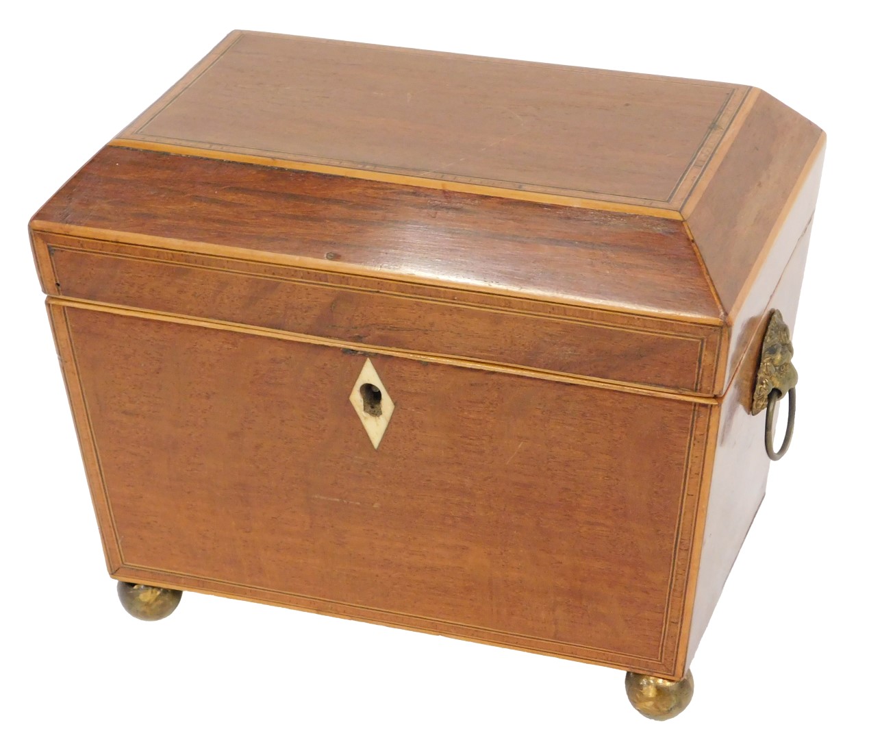 An early 19thC partridge wood tea caddy, the hinged lid enclosing two lidded divisions, on ball feet