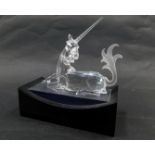 A Swarovski crystal Fabulous Creatures seated unicorn 1996, 11cm high, boxed, with display stand.