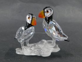 A Swarovski puffin figure group, of two puffins on perch, in blackened and orange crystal, 6cm high,