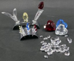 Swarovski crystal ornaments, comprising tulip bed, three hearts, various crystals, and an arched dis