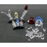 Swarovski crystal ornaments, comprising tulip bed, three hearts, various crystals, and an arched dis