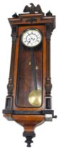 A late 19th/early 20thC Vienna wall clock, in rosewood and ebonised case with eagle crest, turned fi