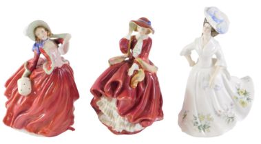 Three Royal Doulton large figures, comprising Adele, Autumn Breezes, and Top of the Hill, 22cm high.