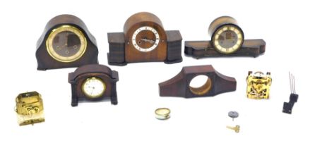 A quantity of early to mid 20thC mantel clocks, mainly in oak cases, some incomplete.