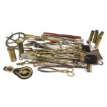 A quantity of brass and other metalware, to include toasting forks, fire implements, etc.