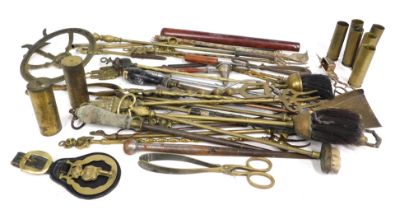 A quantity of brass and other metalware, to include toasting forks, fire implements, etc.