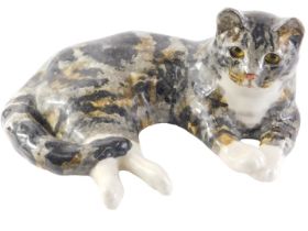 A Winstanley tabby cat, signed to underside, 36cm long.