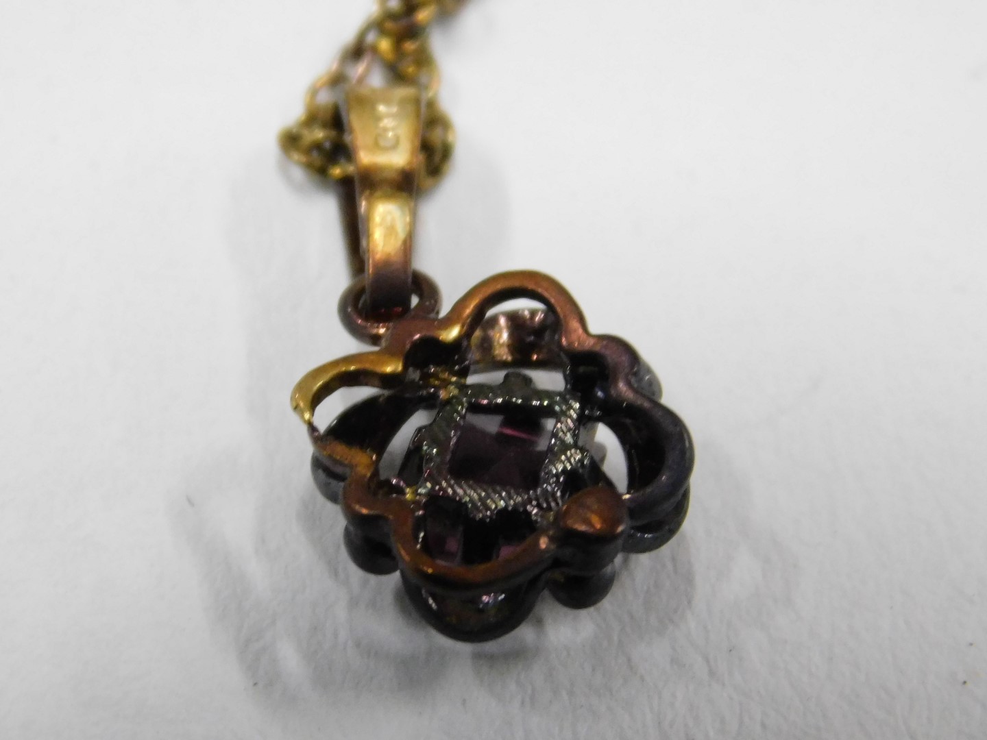 An amethyst pendant and chain, the square cut amethyst in floral loop setting, with gold plated fini - Image 2 of 4