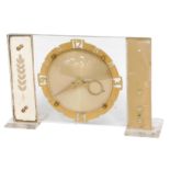 A 1960s mantel clock, with Perspex rectangular moulding, with a cold painted circular dial, 16cm hig