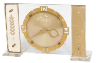 A 1960s mantel clock, with Perspex rectangular moulding, with a cold painted circular dial, 16cm hig