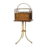 An Edwardian mahogany and tubular brass revolving freestanding four tier magazine rack or Canterbury