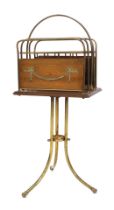 An Edwardian mahogany and tubular brass revolving freestanding four tier magazine rack or Canterbury