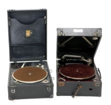 Two cased HMV portable record players.